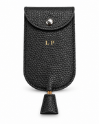 The Concierge Key Pouch in black pebbled leather with gold LP initials