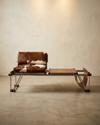 Modern leather lounge chair with cowhide pattern on a neutral background