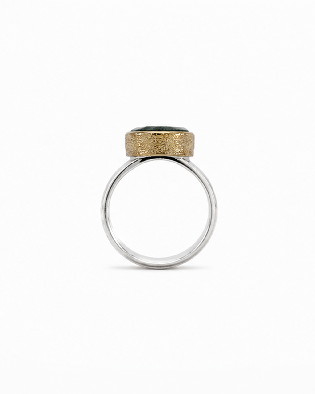 Ring with gold and silver design on a white background