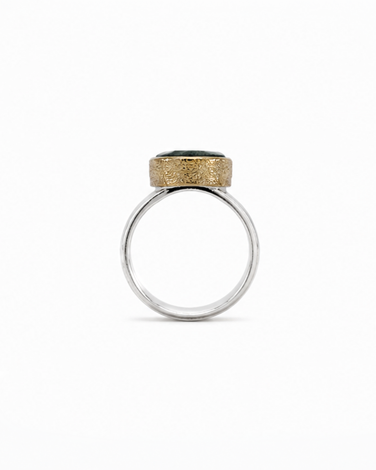Ring with gold and silver design on a white background