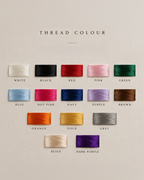 A color chart titled 'THREAD COLOUR' showing multiple small rectangular samples of embroidery thread in different colors, each labeled with its name: White, Black, Red, Pink, Green, Blue, Hot Pink, Navy, Purple, Brown, Orange, Gold, Grey, Beige, and Dark Purple, arranged on a light warm beige background.