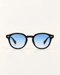 Round black sunglasses with blue gradient lenses, shown against a plain off-white background.
