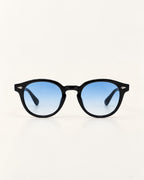 Round black sunglasses with blue gradient lenses, shown against a plain off-white background.