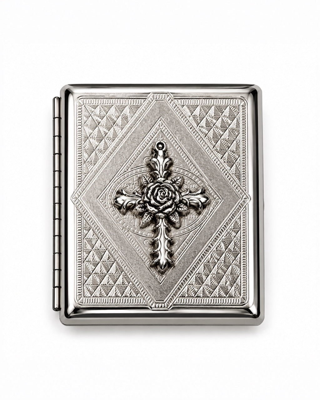 A rectangular silver-toned metal case with an ornate embossed diamond pattern and a central raised cross motif featuring a rose detail, shown on a plain white background.