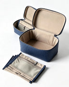 A navy blue and beige zippered organizer case shown open, with a matching set of smaller zippered pouches placed in front on a clean white background.