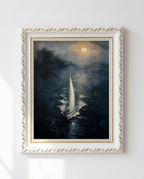 A framed vertical oil painting of a sailboat on dark water under a glowing moonlit sky, displayed on a white wall. The artwork is housed in an ornate white frame with gold detailing.