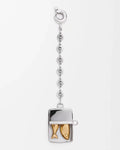 A silver-toned pendant necklace featuring a rectangular fish-shaped charm with two gold-toned fish inside, suspended from a delicate silver chain with a lobster clasp, shown on a plain white background.