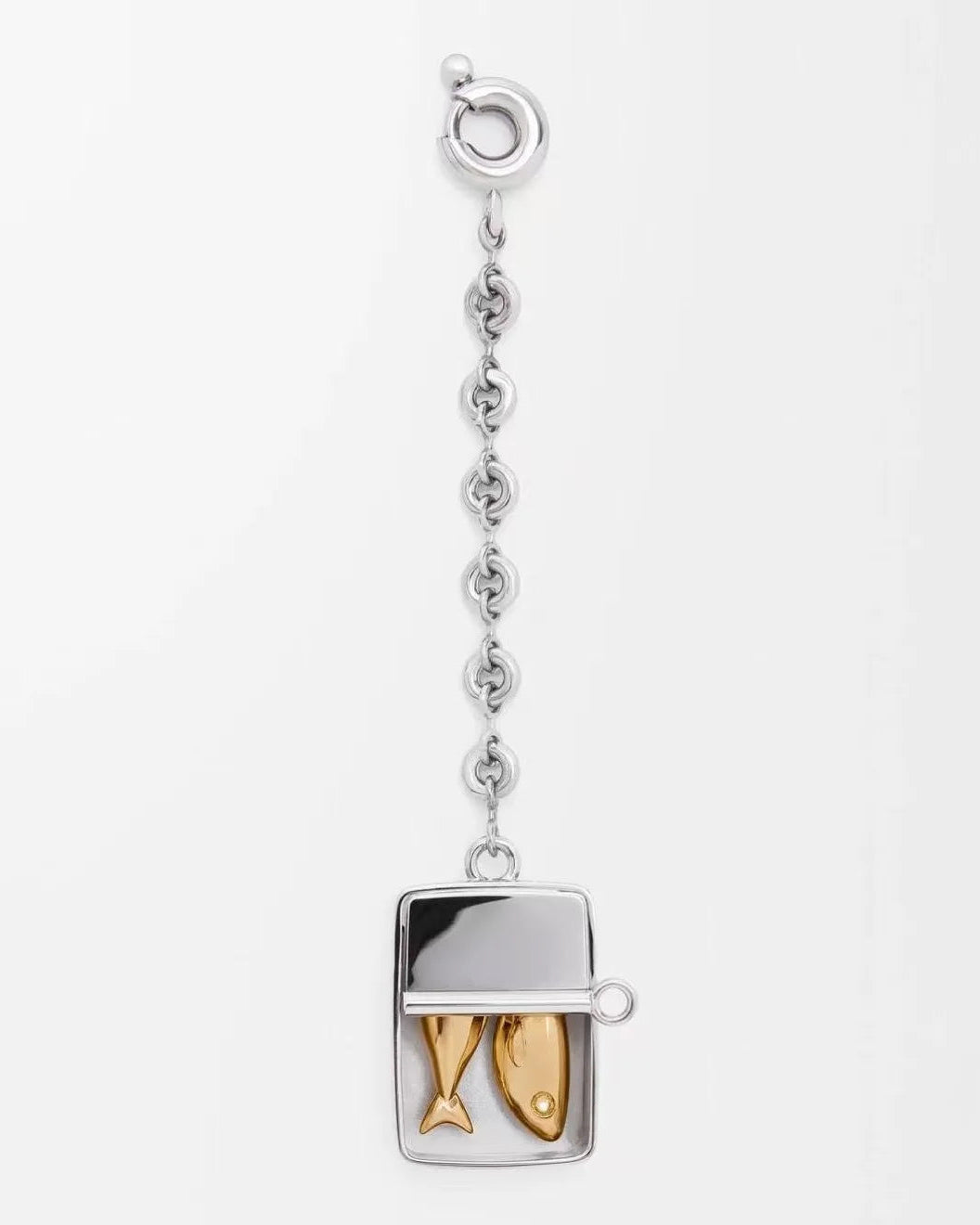 A silver-toned pendant necklace featuring a rectangular fish-shaped charm with two gold-toned fish inside, suspended from a delicate silver chain with a lobster clasp, shown on a plain white background.