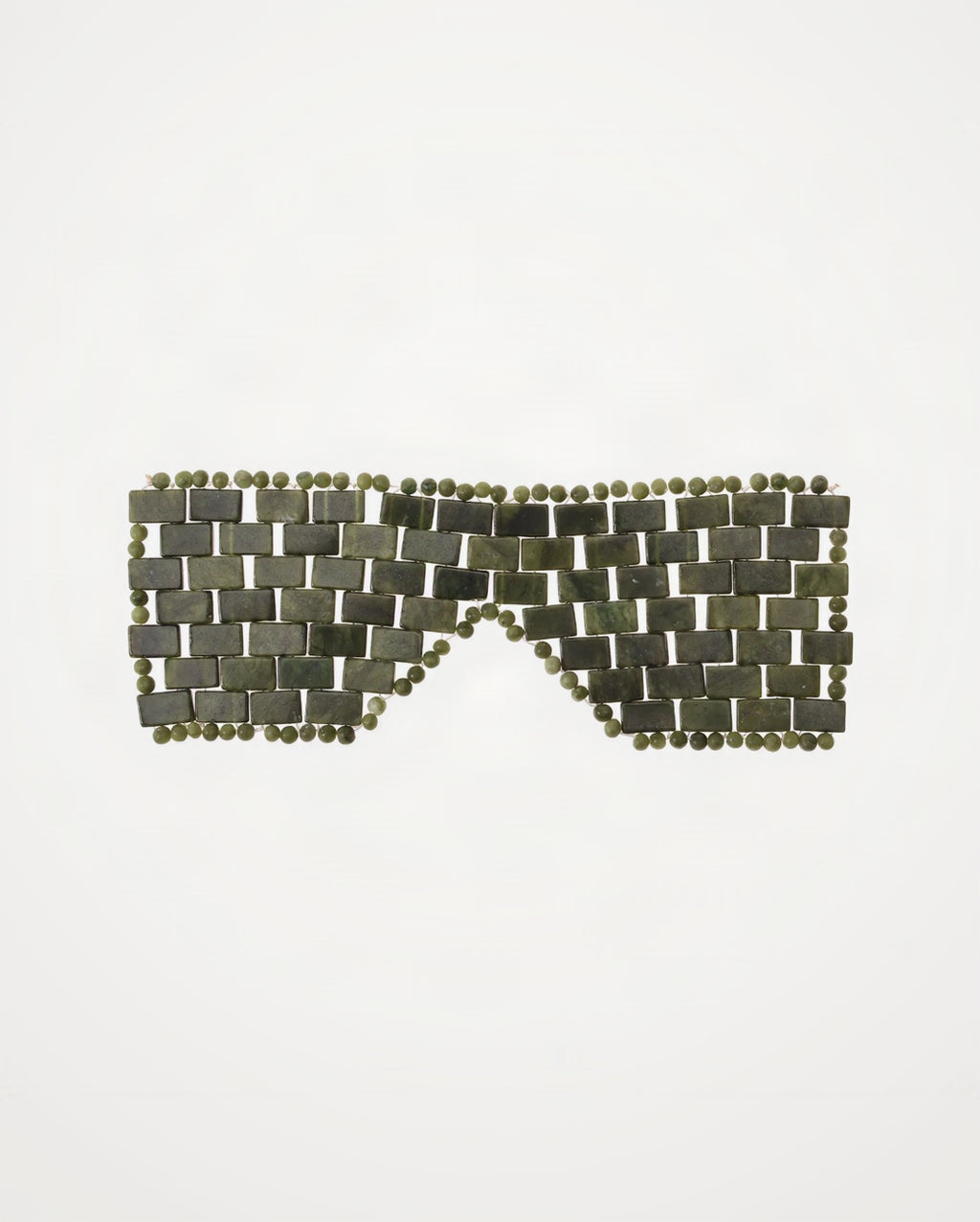 Mosaic pattern of green tiles on a white background