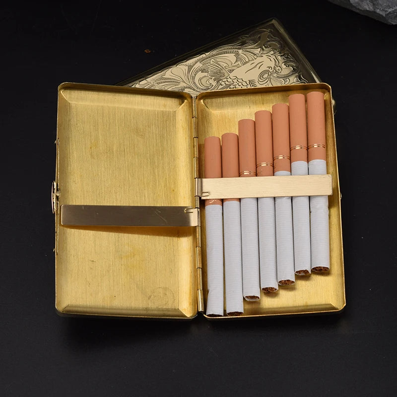 An open gold-toned metal cigarette case on a black background, holding several cigarettes arranged vertically in a light wood divider.