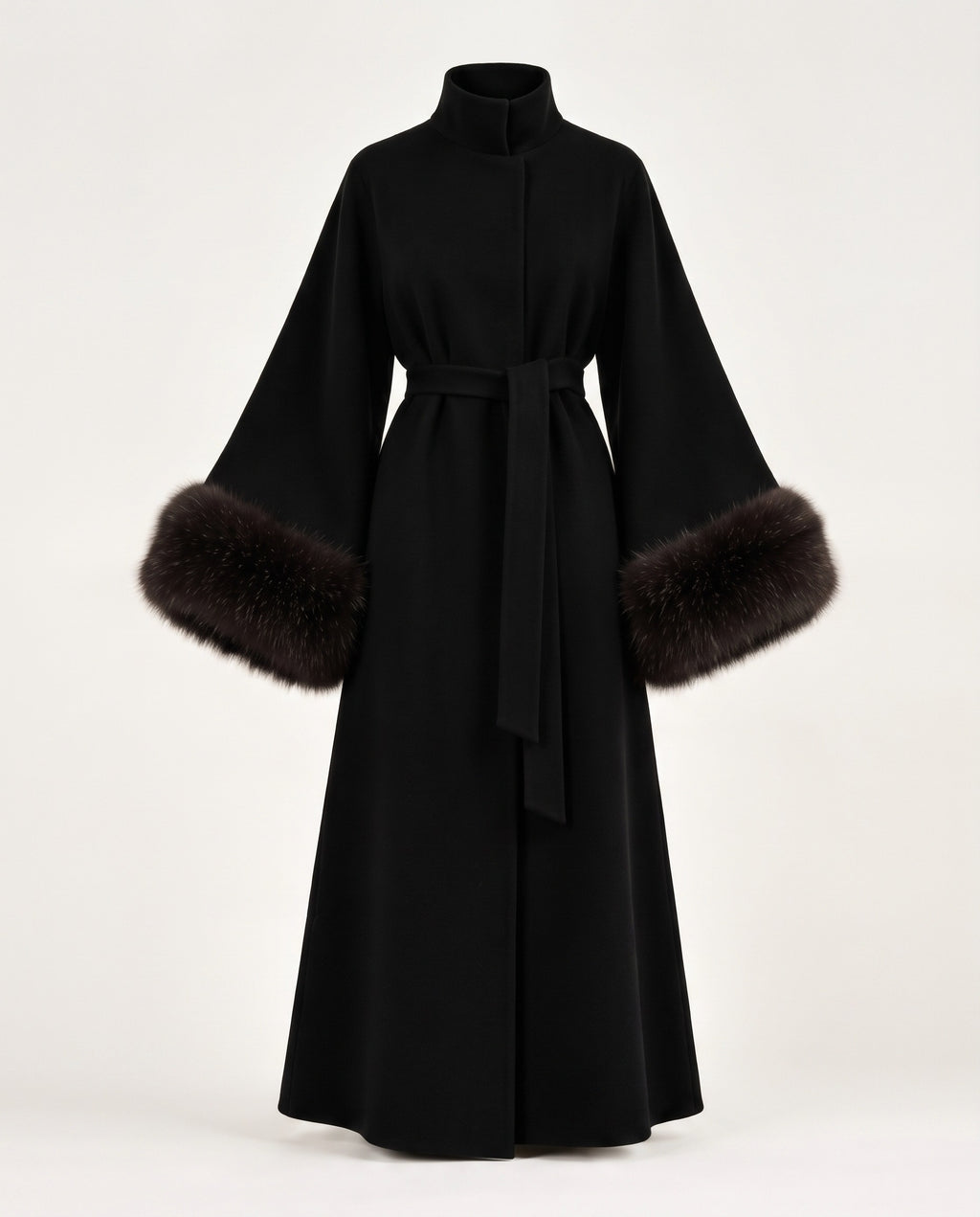 A long black wrap coat with a high collar, wide sleeves, and dark brown fur trim at the cuffs, shown on a plain light background.