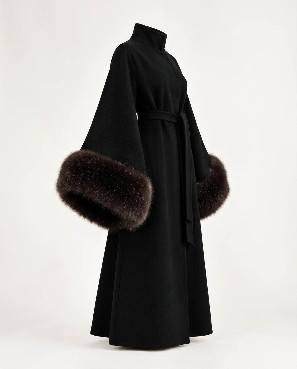 A black long coat with wide sleeves and dark brown fur trim at the cuffs, shown on a plain light background.