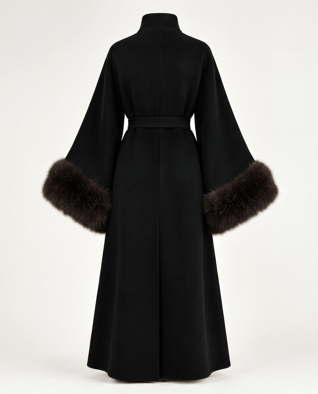 A black long-sleeved wrap coat with a high collar and a matching waist belt, featuring dark brown fur trim at the wide sleeves, shown from the back on a white studio background.
