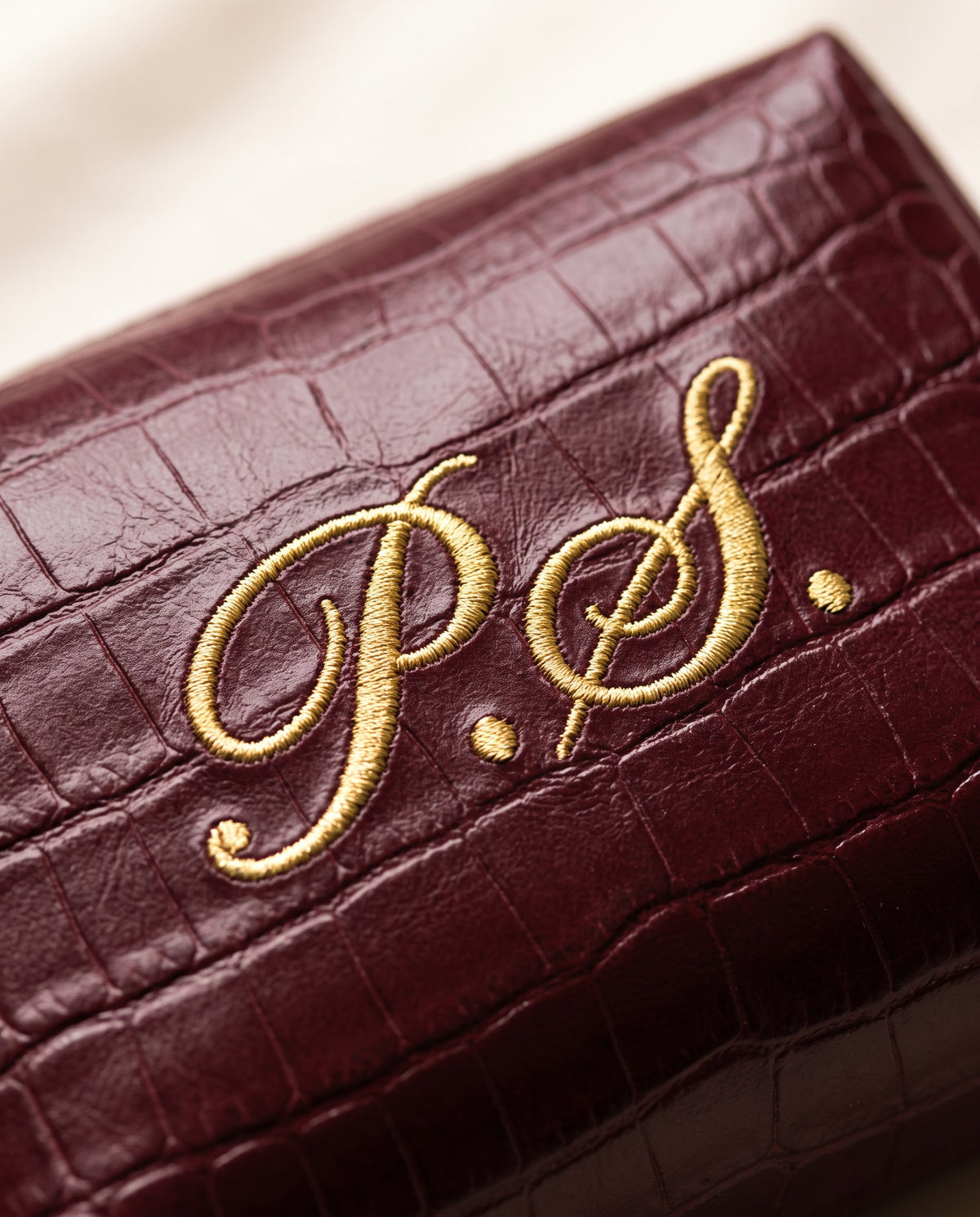 Close up of the embroidered initials on the Mayfair Pouch
