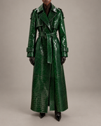 Model wearing The Riviera Leather Trench in green croc embossed leather, belted at the waist