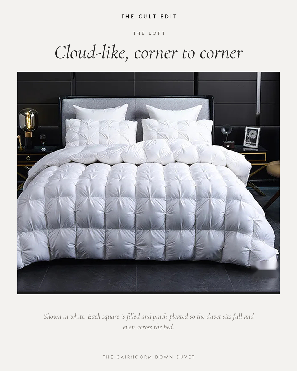 The Cairngorm Down Duvet in white on a bed