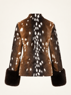 A brown faux fur jacket with a white spotted deer print on the back and collar, featuring dark brown faux fur cuffs, shown against a plain off-white background.