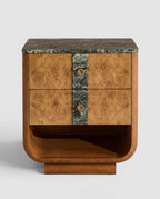 A mid-century modern wooden nightstand featuring burl wood drawer fronts, a dark green marble top and center panel, and gold-toned shell-shaped drawer pulls, set against a light gray background.