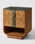 Art Deco style nightstand featuring a curved wood body, burl wood drawer fronts, a central dark green marble vertical panel with shell-shaped brass knobs, and a dark green marble top, shown on a light gray background.