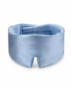 A light blue satin sleep mask with a smooth, lustrous finish, photographed on a clean white background.
