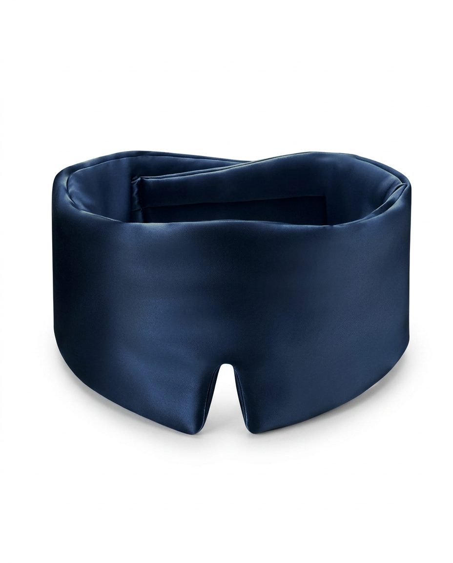 A navy blue satin sleep mask with a smooth, lustrous finish, photographed on a clean white background.