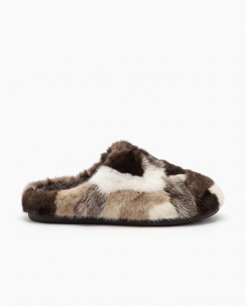 A single plush slipper in a patchwork faux fur pattern of brown, beige, and cream, shown from a side profile against a plain white background.