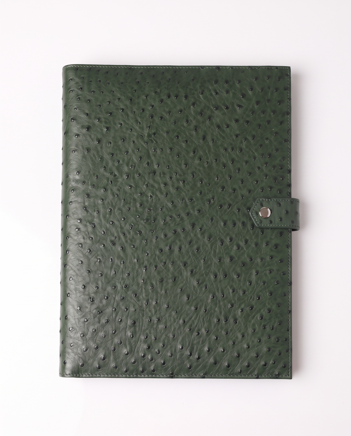 A dark green ostrich leather notebook cover with a snap-button strap closure, shown flat against a clean white background.