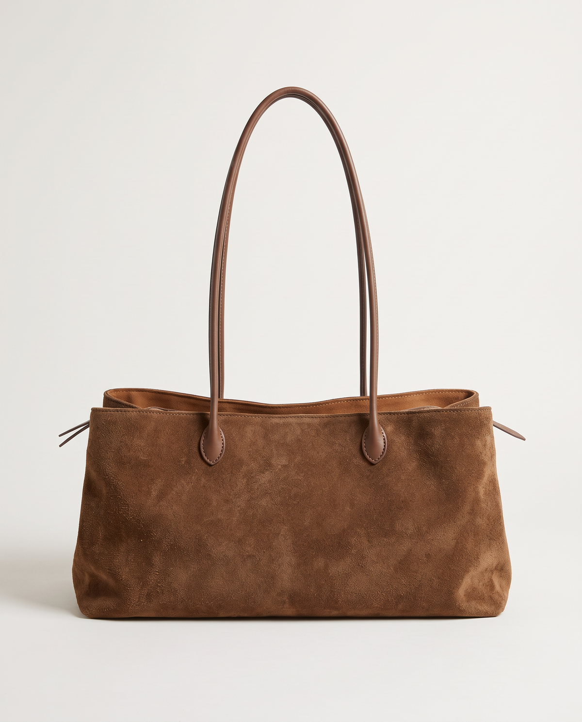 The Marais Tote in Brown suede, front view with long leather handles