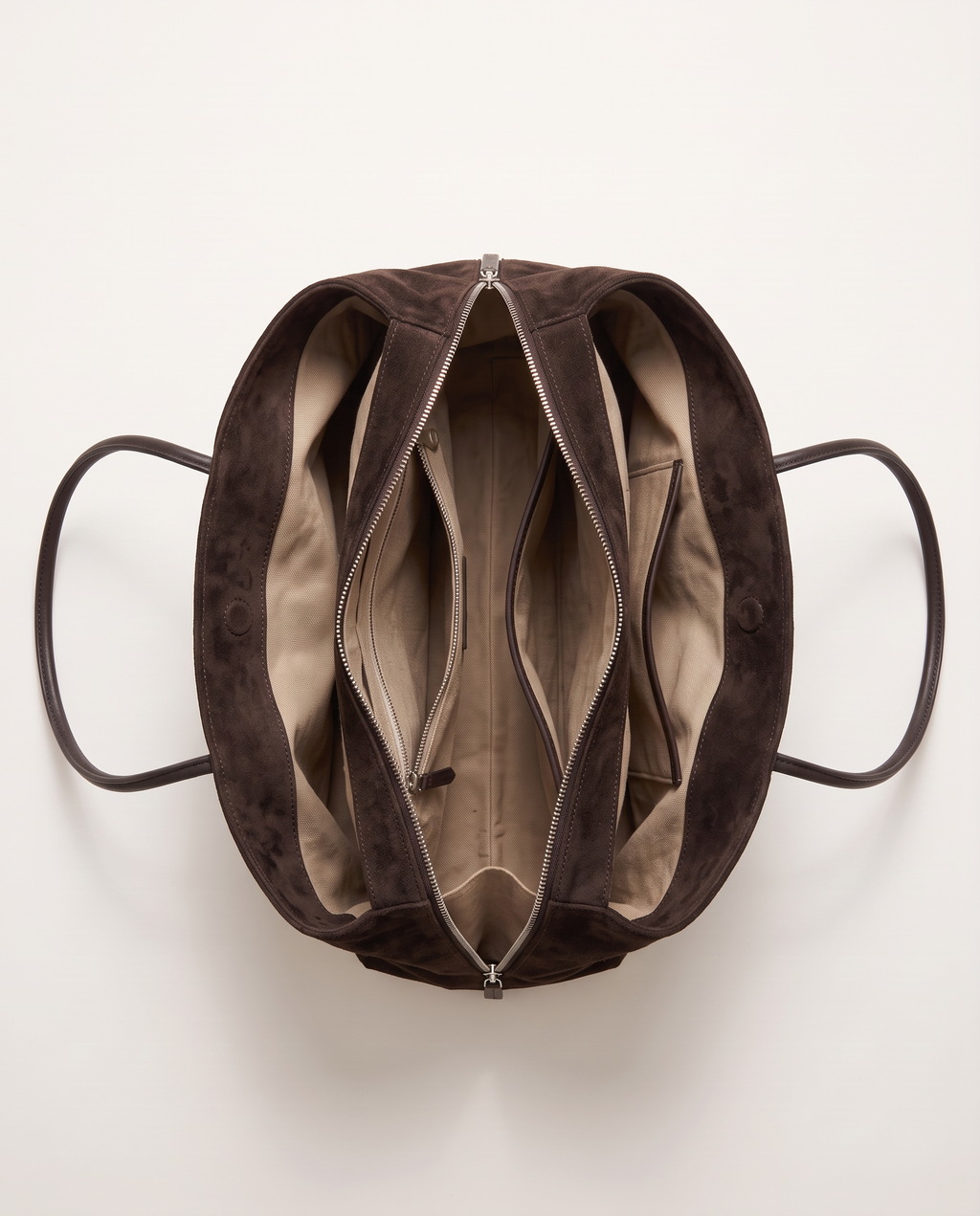 The Marais Tote in Dark Coffee from above, unzipped to show the cotton lining and inside pockets