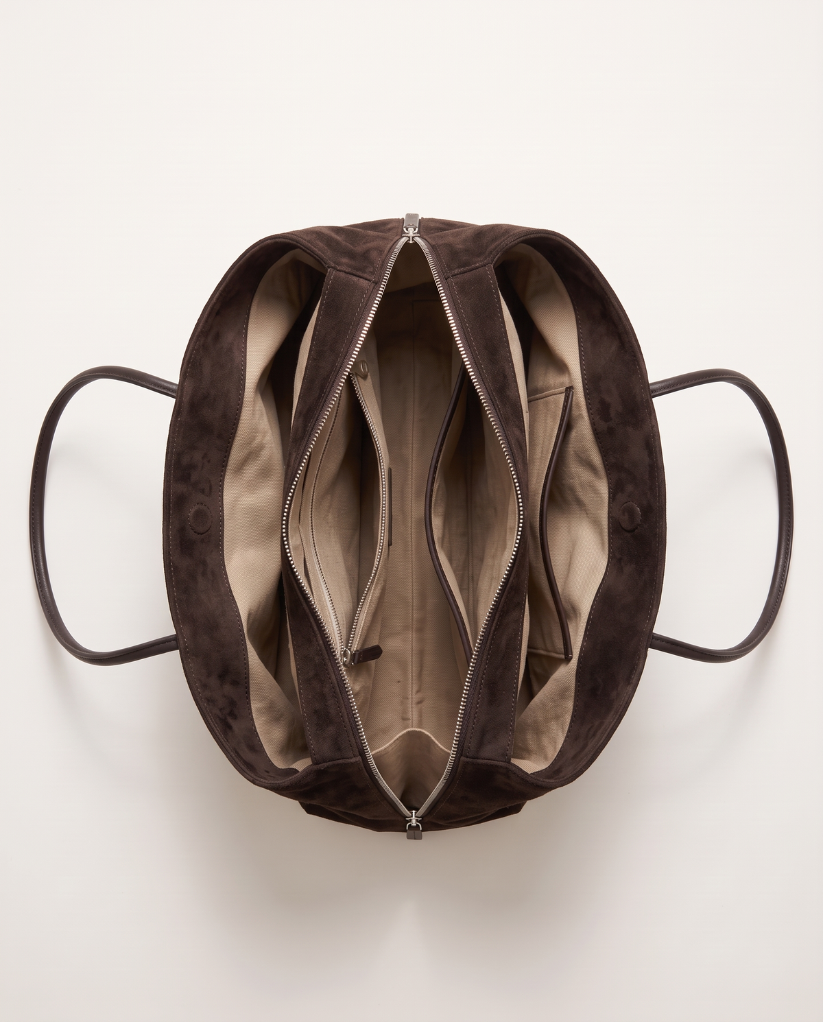 The Marais Tote in Dark Coffee from above, unzipped to show the cotton lining and inside pockets