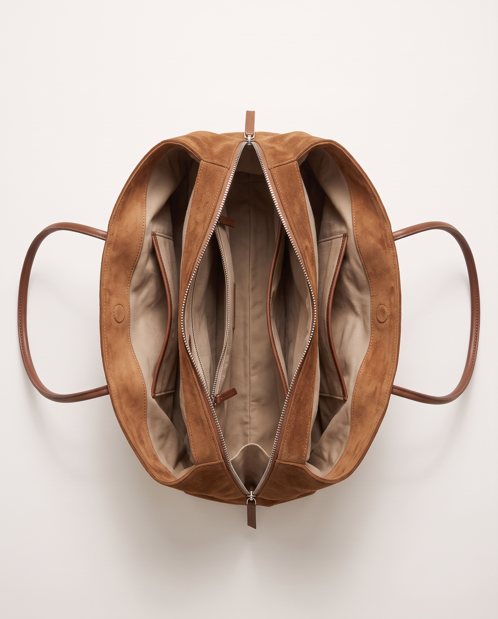 The Marais Tote in Brown from above, unzipped to show the cotton lining and inside pockets