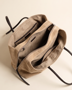 The Marais Tote in Apricot, unzipped to show the cotton lining, slip pocket and zip pocket