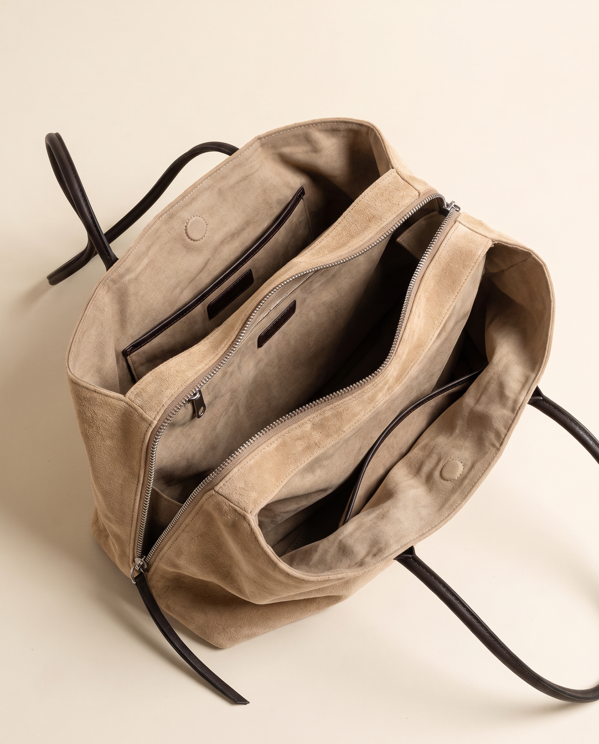 The Marais Tote in Apricot, unzipped to show the cotton lining, slip pocket and zip pocket