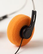 Close-up of the orange foam ear pad on The Mixtape Headphones