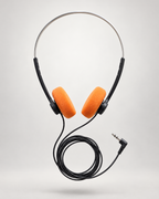 Over-ear wired headphones with bright orange foam ear pads and a black headband and cable, shown floating against a light gray studio background.