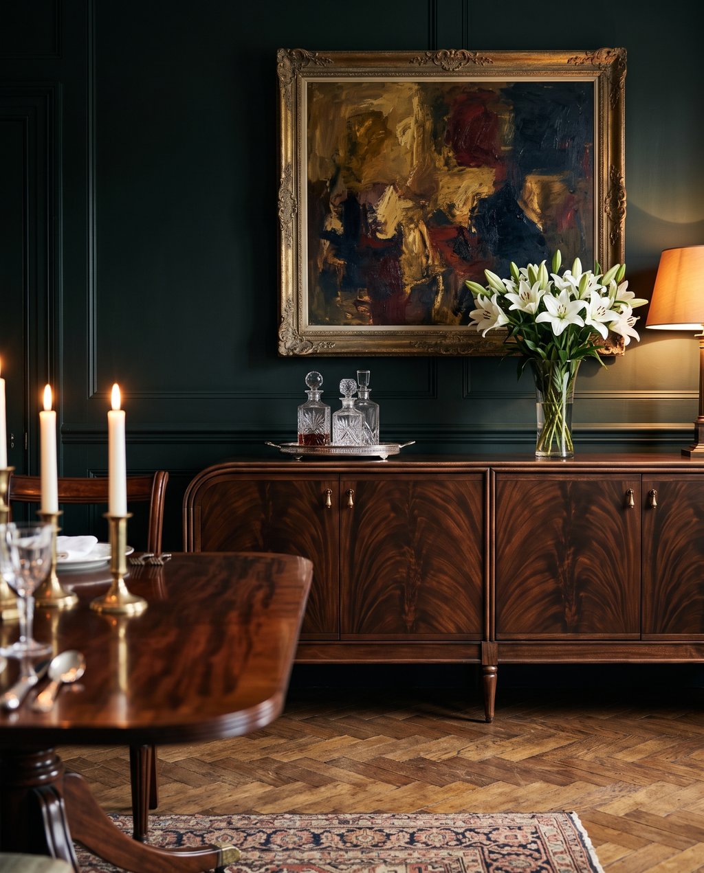 The Mayfair Sideboard in a green panelled dining room with decanters and lilies