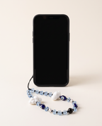 The Daydream Phone Strap attached to a black phone