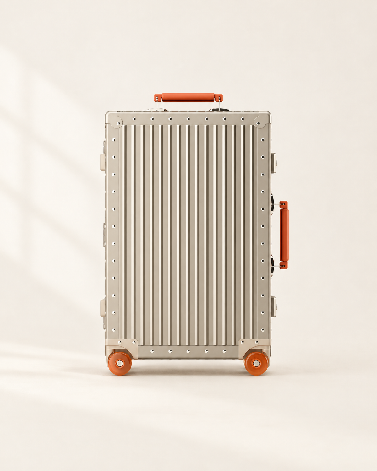 The Meridian Suitcase in gold with orange