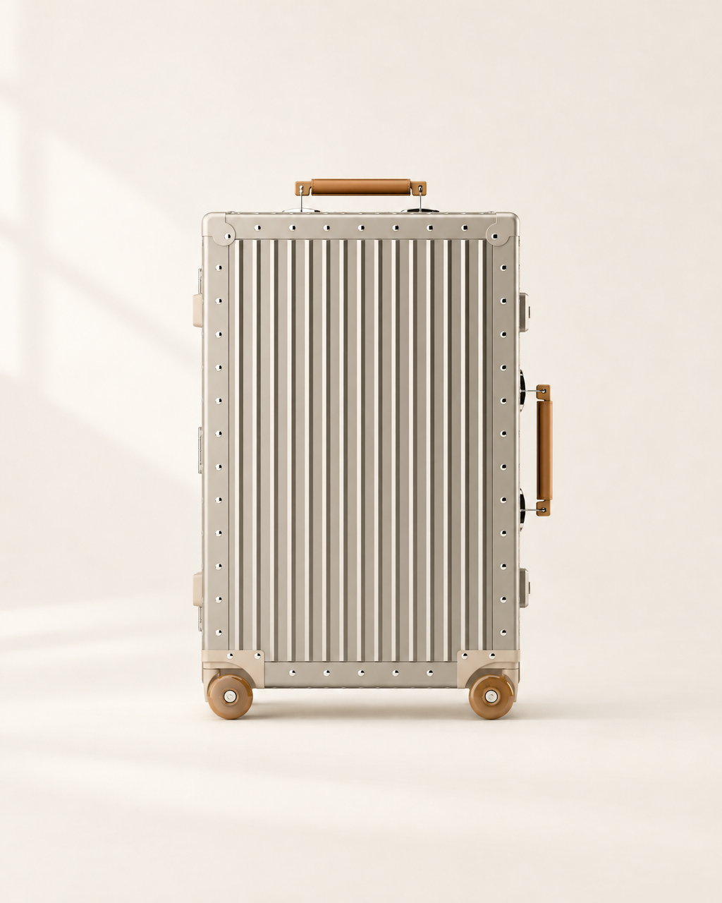 The Meridian Suitcase in gold with brown