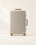 The Meridian Suitcase in gold with brown