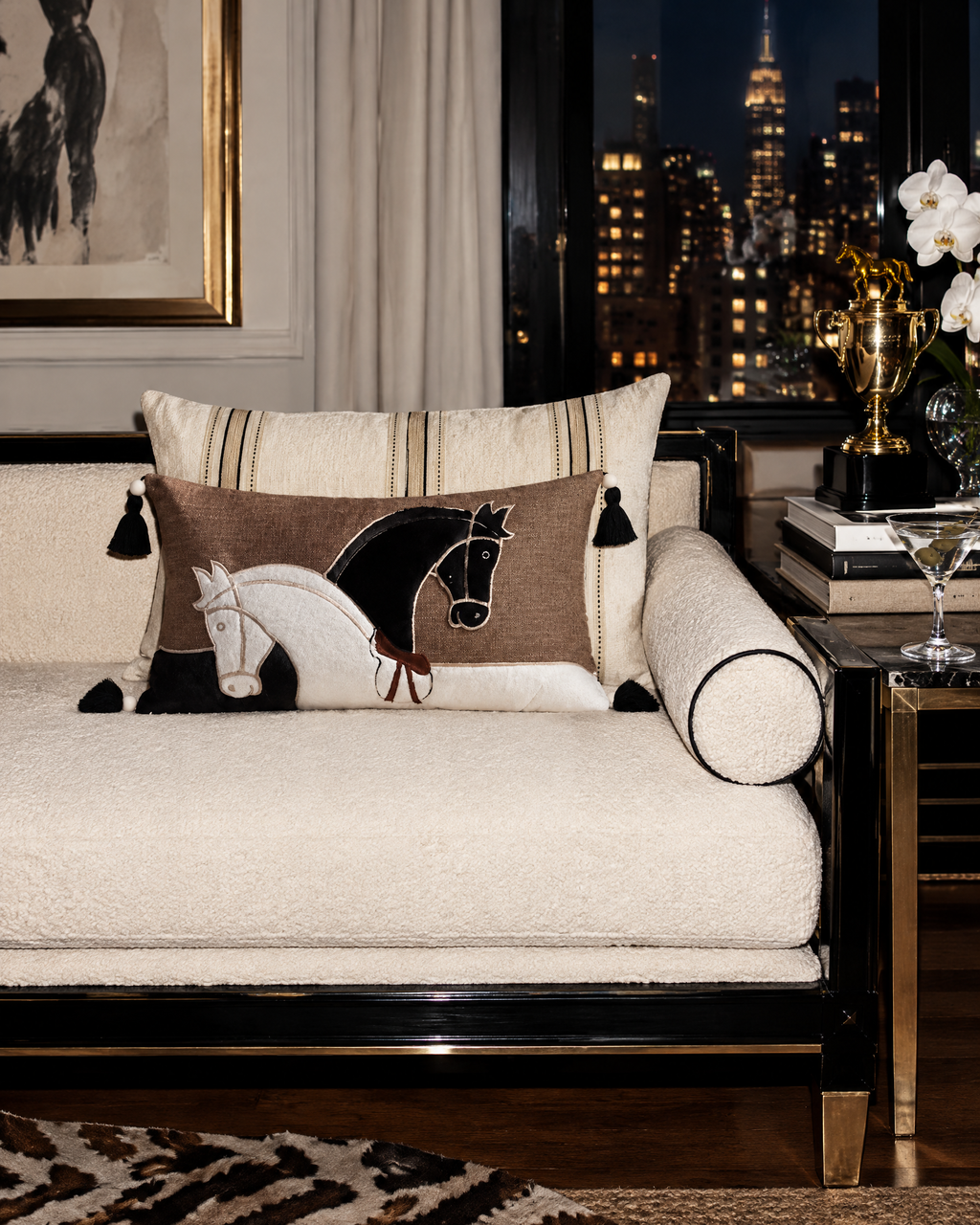 The Paddock Cushion Covers on a city daybed at night