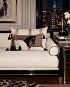 The Paddock Cushion Covers on a city daybed at night