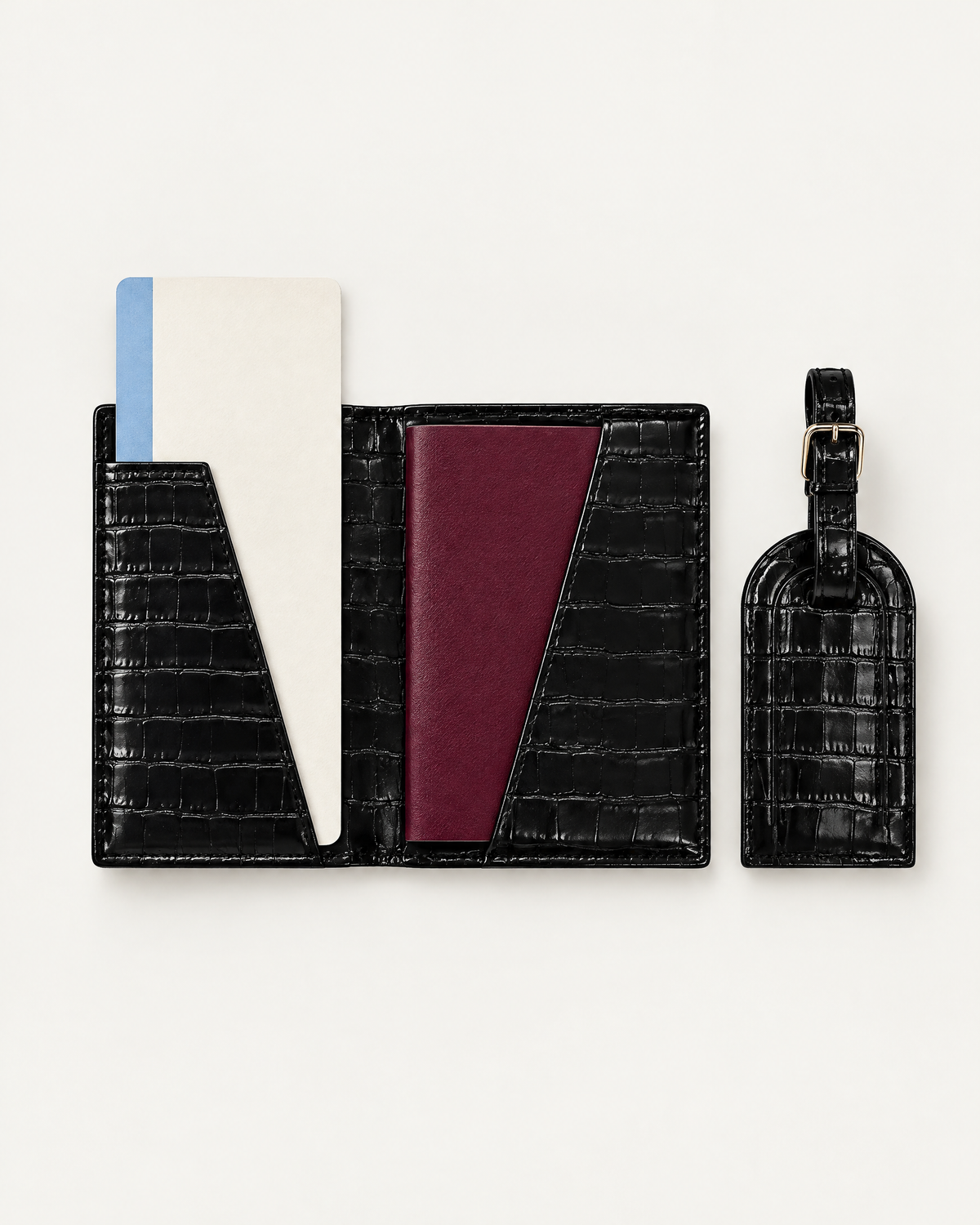 The Grand Voyage Travel Set in Croc Black, open with passport and ticket