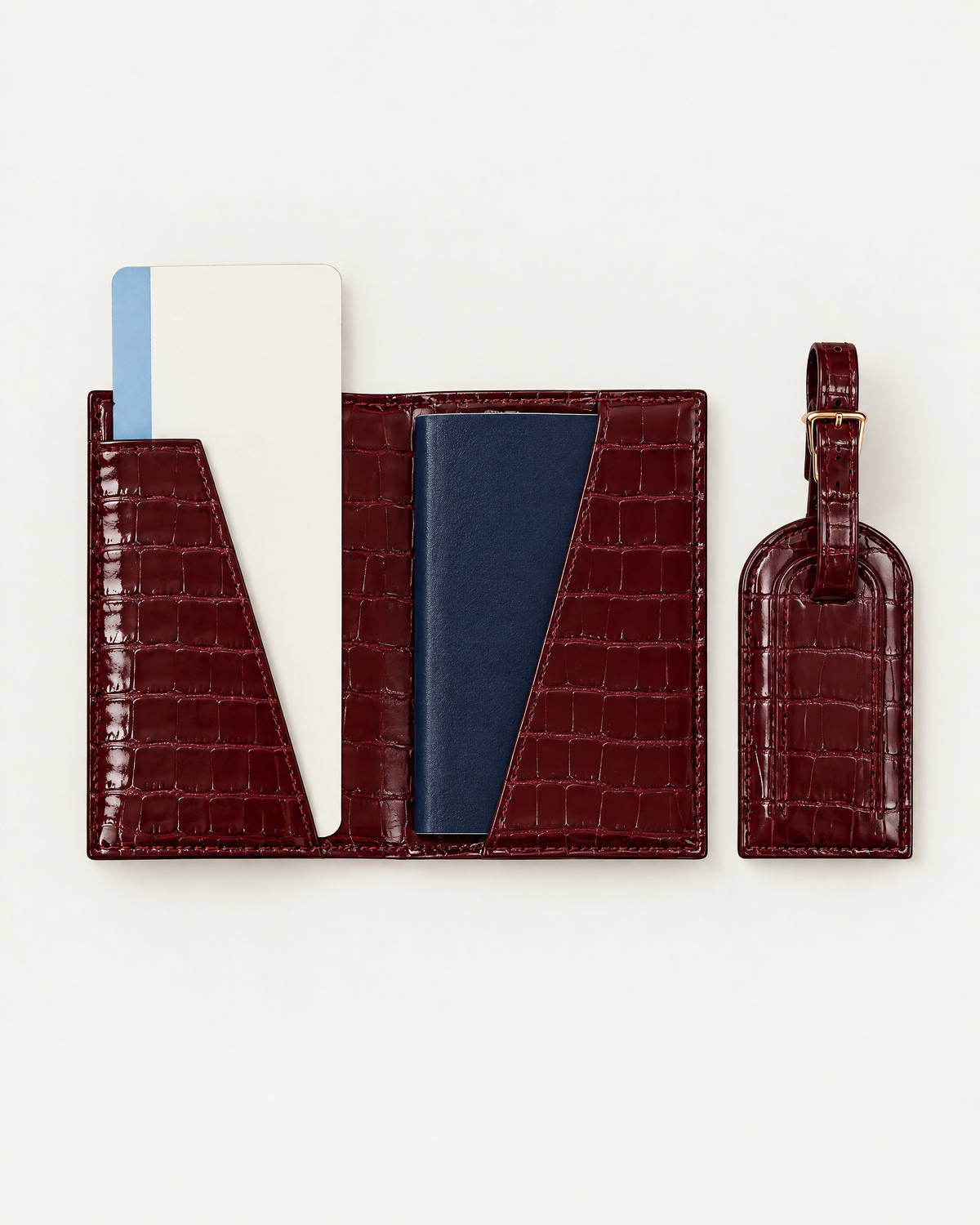 The Grand Voyage Travel Set in Croc Burgundy, open with passport and ticket