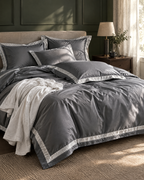 The Kensington Sateen Bedding Set in Slate, unmade in the morning