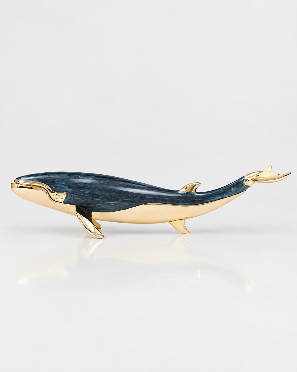 The Nantucket Whale in midnight blue enamel and gold-tone metal