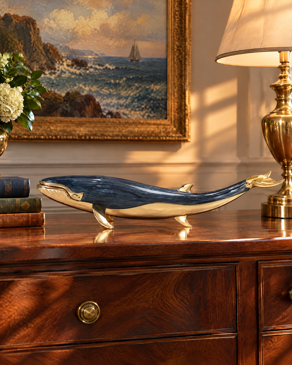 The Nantucket Whale on a mahogany sideboard beneath a seascape