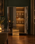 The Mercury Cabinet open as a lit bar with glasses and a decanter