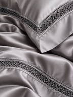 Close-up of the open lace insert border on The Belgravia Lace Bedding Set in Silver Grey