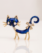 The Midnight Cat Brooch standing with a soft reflection